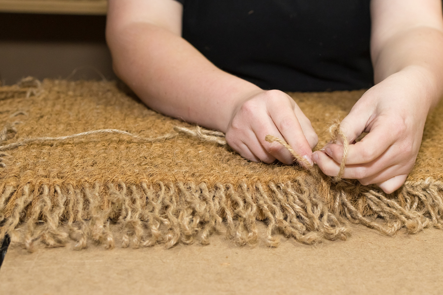 Hand-stitched coir mats
